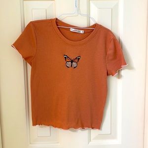 Orange ribbed butterfly crop top